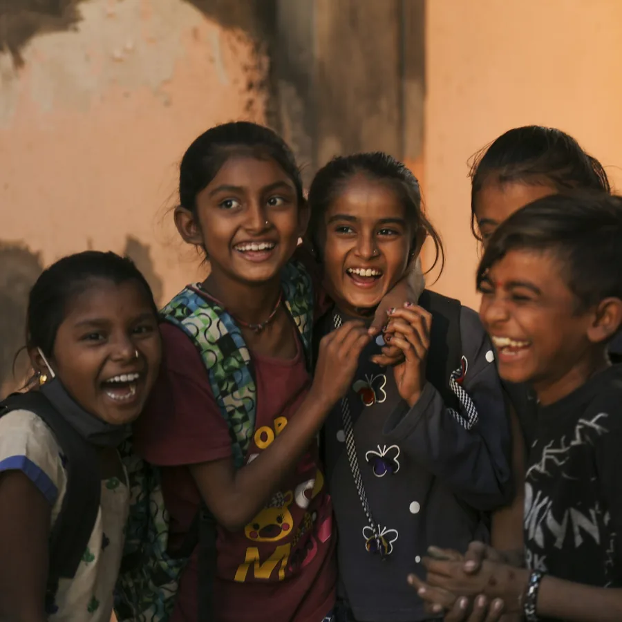 Schoolgirls laughing together